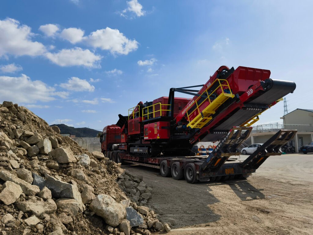 SUHMAN SE-1060 mobile jaw crusher operating on 15-degree slope at granite quarry with wireless remote travel control